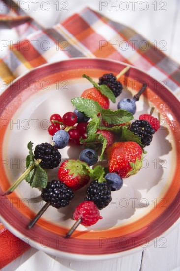 Presentation set of skewers of berries, summer dish