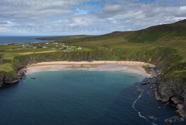 A drone aerial view of the beautiful Silver Strand and horseshoe bay at Malin Beg on the Wild Atlantic Way of Ireland