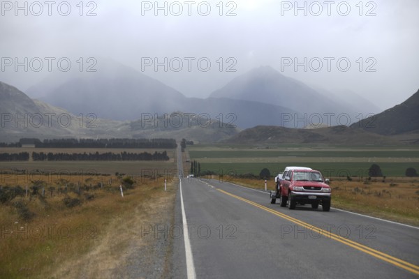 Traffic heading for Christchurch on SH73 leaves behind the rain on the West Coast