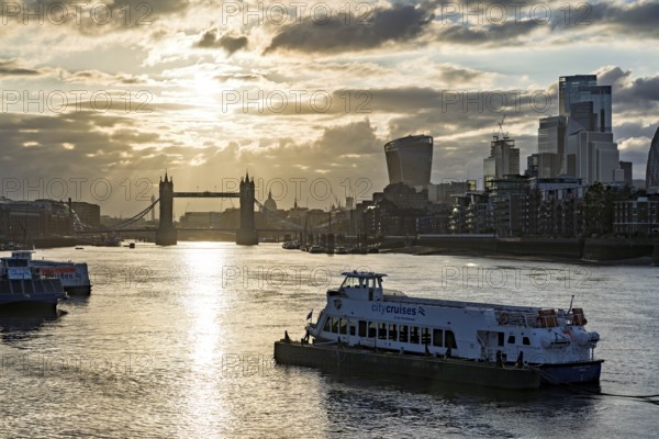 View over the Thames with Tower Bridge and the skyline in the evening light, London, England, Great Britain