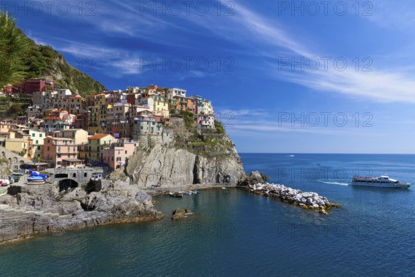 Village of Manarola with ferry, Cinque Terre, Italy, Europe