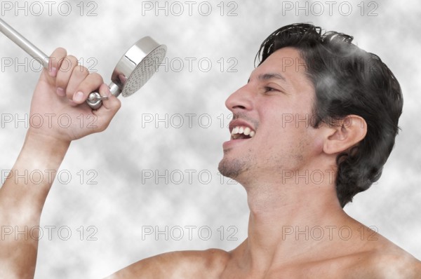 Young man performing a concert by singing in the shower
