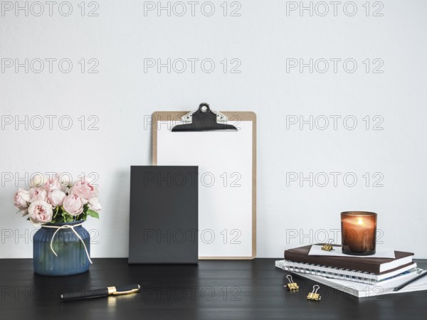 Empty chalkboard on table. Home office concept or mockup. Chalkboard mock up portrait format, copy space for text