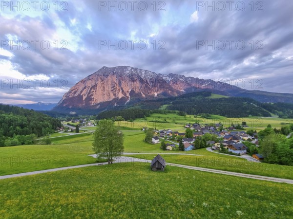 Summer austrian landscape with Grimming mountain (2.351 m), an isolated peak in the Dachstein Mountains, view from small alpine village Tauplitz, Styria, Austria, Europe