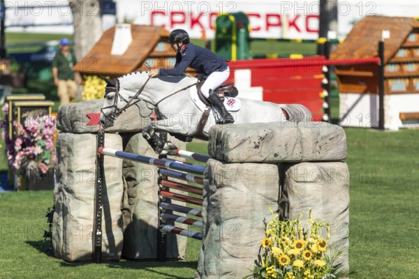 Donald Whitaker of Great Britain, riding Picasso VD Zwartbleshoeve compete in the BMO Nations Cup during the CSIO Spruce Meadows, Masters, in Calgary, Alberta, Canada, North America
