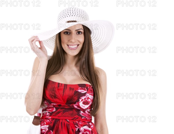 Young woman wearing red dress on white background, Toronto, Canada, North America
