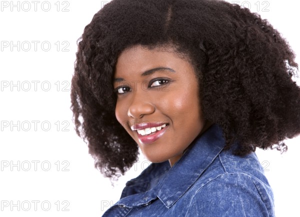 Beautiful young black woman is wearing jean dress on white background, Toronto, Canada, North America