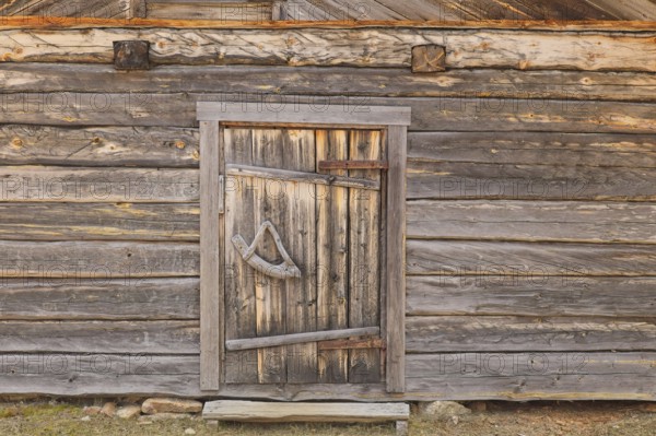 Closed old wooden door on an old building, Lapland, Finland, Europe