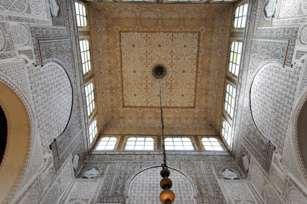 Meknes, Opulent vaulted ceiling with mosaic patterns and a hanging chandelier, Northern Morocco, Morocco, Africa