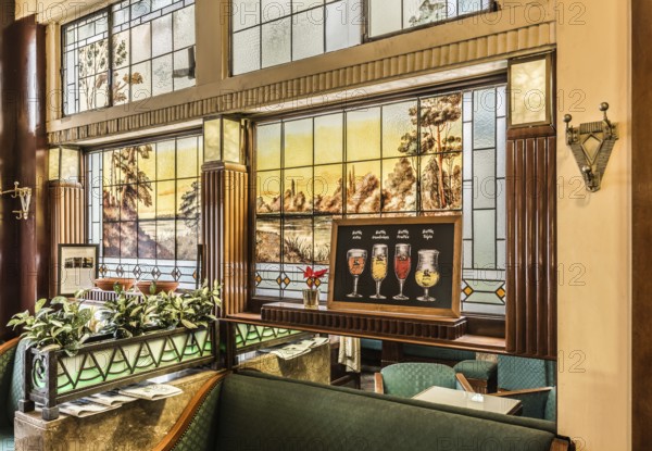 Brussels, Belgium, 01 18 2019: Art deco interior design of the tavern L'Espérance with stained glass and old furniture, Europe