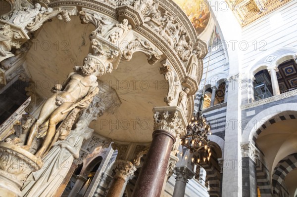 Pisa, Italy, 29 June 2023. Cathedral interior. The pulpit, Medieval art masterpiece by sculptor Giovanni Pisano, 1310, Europe