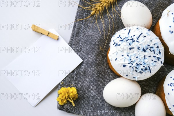 Happy Day Bright Easter. Orthodox Easter holiday. Traditional food. Creative stylish trend Homemade easter cake and eggs. Copy space sheet paper. Kulich Festive easter background Minimalism