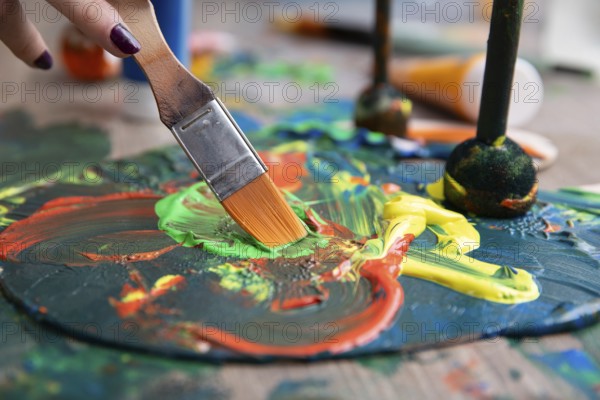 A vibrant and lively scene of paint mixing vividly on a canvas, showcasing colorful strokes and intricate brushwork
