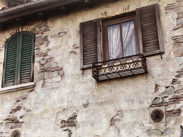 Old rustic house windows, antique architecture in Venetian style