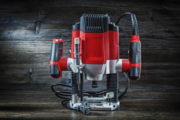 Red speed variable power small plunge router milling machine portable electric hand mini wood router on vintage wood