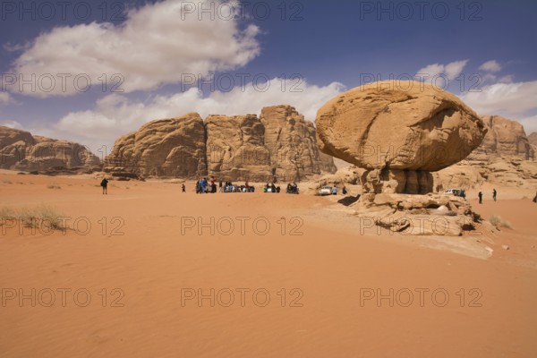 Wadi Rum desert, Jordan, March 2020: People gathering around Mushroom Rock in the Wadi Rum desert in Jordan, Asia