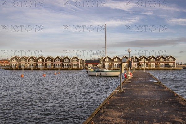 Harbour by the lake, landscape shot in autumn. Holiday village and harbour by the water in Sunnana Hamn in Sweden