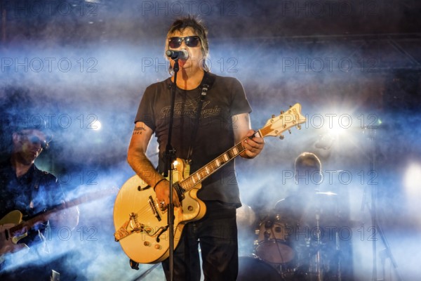 Madrid, Spain, 2022 July, 16: La Frontera rock band playing at the Carmen festivities in Chamberi. Javier Andreu and Tony Marmota western rock band performing in free music festival in Madrid, Europe