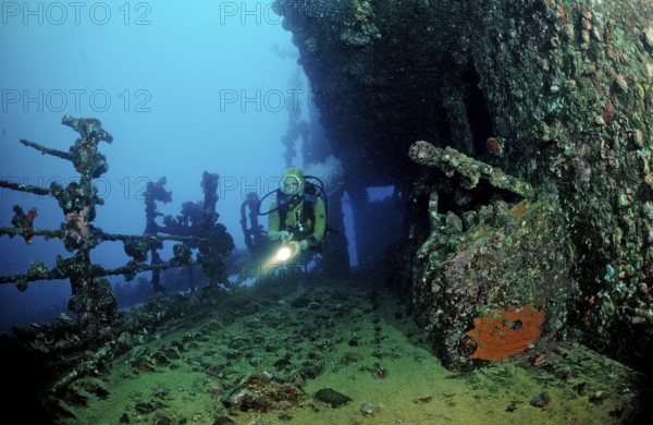 Diver on the Umbria shipwreck, Sudan, Africa, Red Sea, Wingate Reef, Africa