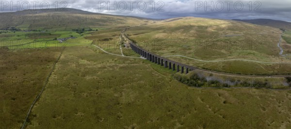 Ribblehead Viaduct, railway viaduct in the Yorkshire Dales, behind Whernside mountain, drone shot, Carnforth, England, Great Britain