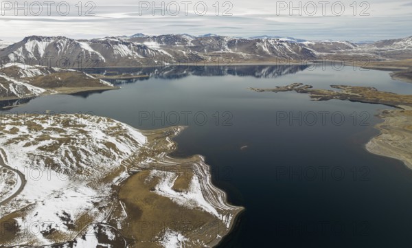 Aerial view of the Snowy Andes and Maule Lagoon at the Pehuenche border crossing between Chile and Argentina
