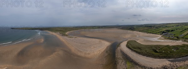 A panorama drone landscape view of the beautiful golden sand beach at Lacken Strand on the coast of North Mayo in Ireland