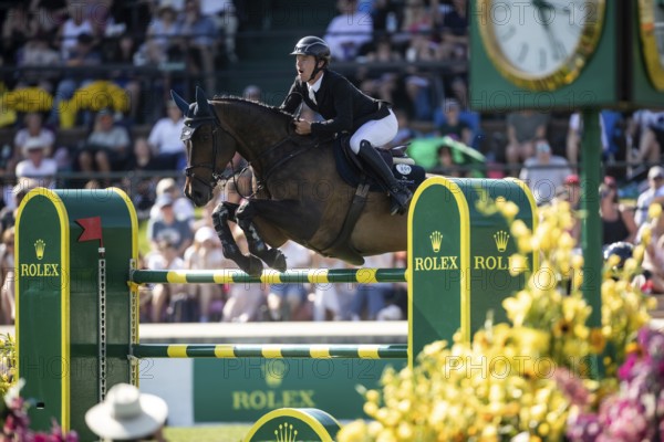 Michael Pender of Ireland and riding HHS Calais compete in the first round of the 1.60m CPKC International during the Spruce Meadows Masters, presented by Rolex, in Calgary, Alberta, Canada, North America