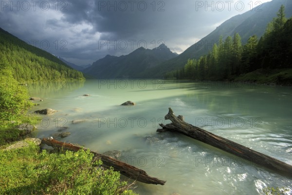 Beautiful mountain landscape near the lake. Mountain Lake. Kind of mountainous terrain and the water in the valley