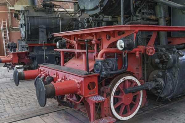 Lateral railway component of a steam locomotive with red and black components, Bochum, North Rhine-Westphalia, Germany, Europe