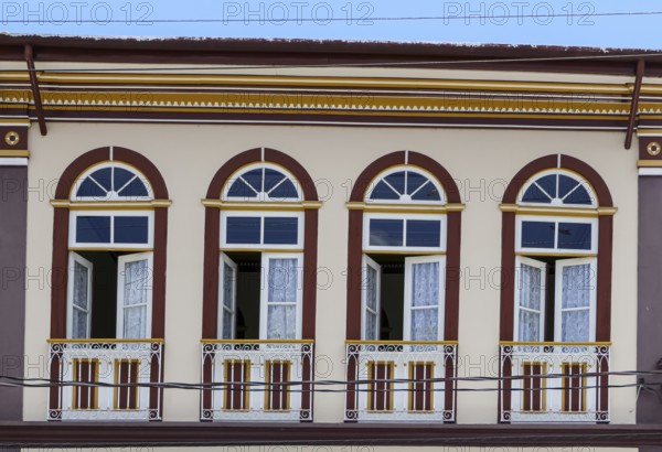 Close-up of a colonial house facade with windows and doors in historical town São Luíz do Paraitinga, Brazil, South America