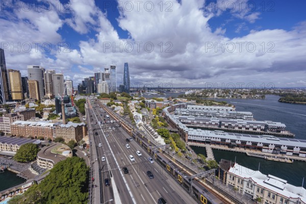 SYDNEY, AUSTRALIA, MARCH 4 2023: The Sydney CBD and surrounding harbour, including Circular Quay and The Rocks on a clear autumn day in Sydney, Australia, Oceania