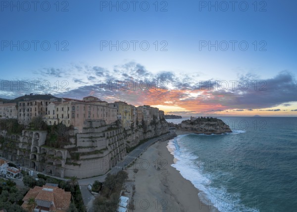Tropea, Italy, 16 December, 2023: panorama view of Rotonda Beach and the colourful old town of Tropea in Calabria at sunset, Europe