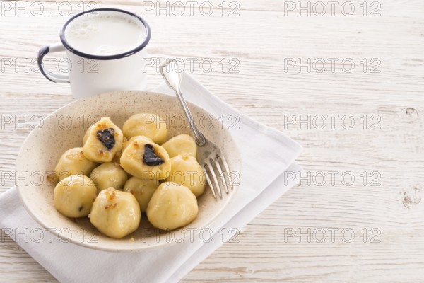 Potato dumplings with plums full