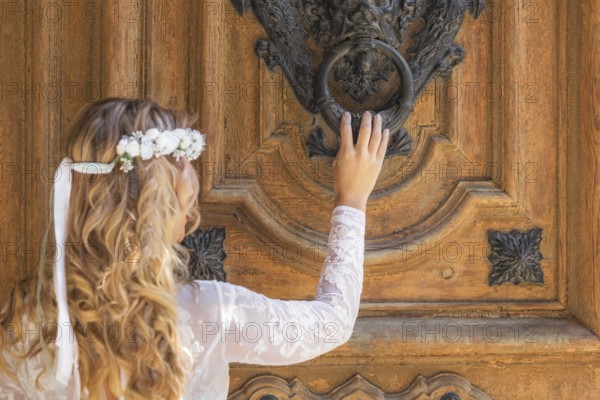 Beautiful bride portrait on old wooden door background