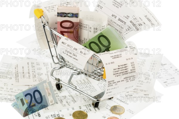 Shopping trolley, banknotes and receipts, symbolic photo for purchasing power, consumption and inflation