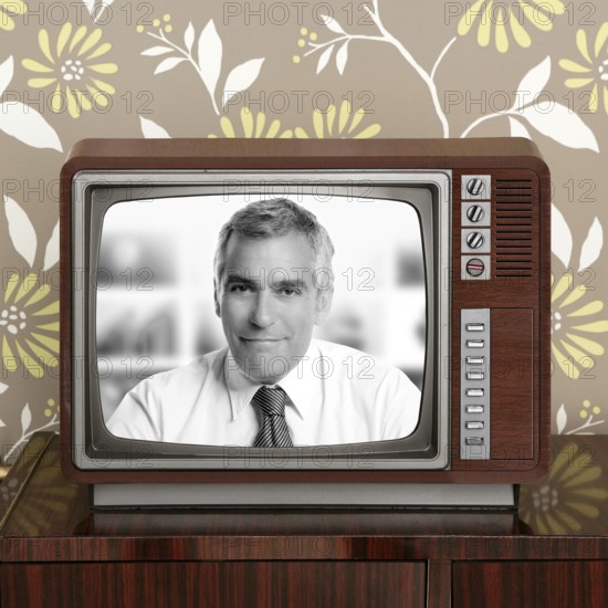 Senior tv presenter in retro wood television vintage wallpaper