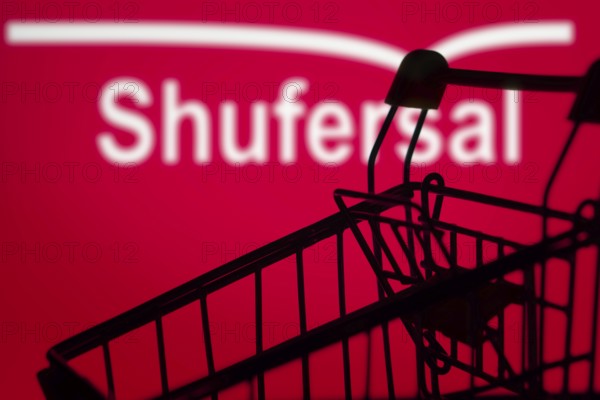 A silhouette of a shopping cart is in front of shufersal. Super-sal, is the largest supermarket chain company