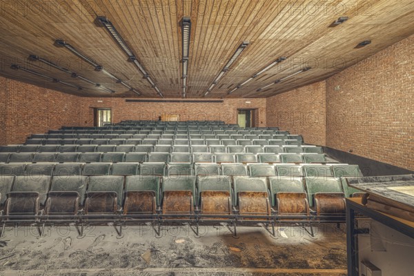 Dusty, empty lecture theatre with green rows of seats and visible bricks, Institute of Molecular Biology, Lost Place, Sint-Genesius-Rode, Province of Flemish Brabant, Belgium, Europe