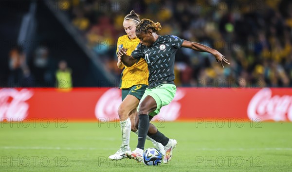 BRISBANE, AUSTRALIA, JULY 27: Caitlin FOORD of Australia and Christy UCHEIBE of Nigeria tackle as Australia plays Nigeria at the FIFA Women's World Cup Australia New Zealand 2023 at Brisbane Stadium on July 27, 2023