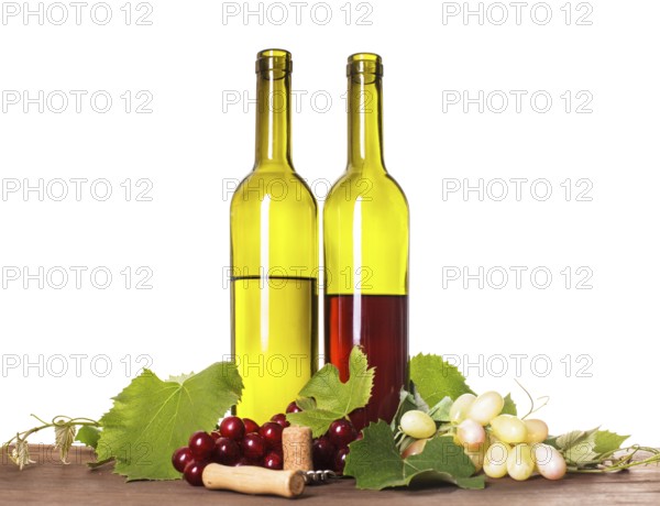 Red and white wine in bottles on the wooden table