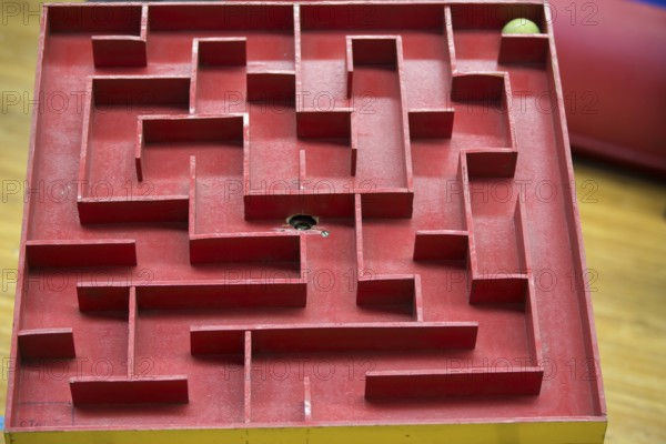 Wooden labyrinth with a ball