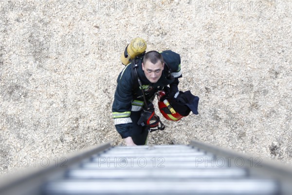 Belarus, Gomel, 04/06/2017, Extinguishing forest fire.Belarus.Firefighter will climb the stairs.Work firefighter. Extinguish the fire. Rescue work. Exercises of rescue workers, Europe