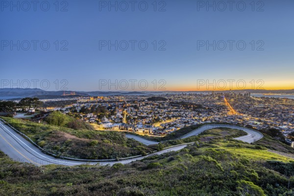 San Francisco with the Golden Gate Bridge in front of sunrise
