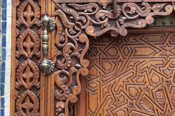 Rich decorated door in an Arab palace in Marrakech, Morocco, Africa