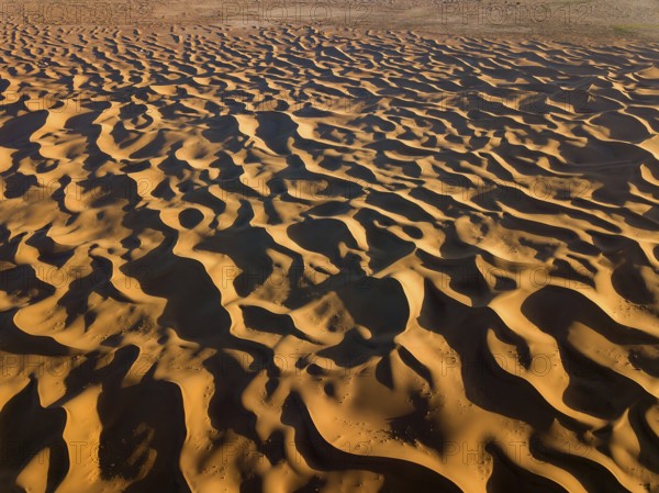 Aerial top view on sand dunes in Sahara desert