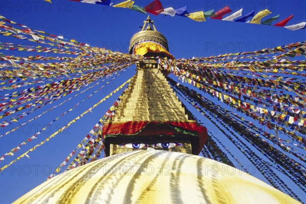 Bodnath Stupa in Nepal decorated with colourful flags