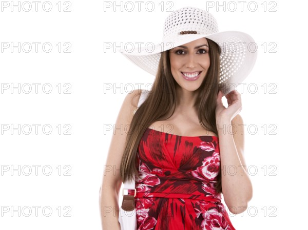Young woman wearing red dress on white background, Toronto, Canada, North America