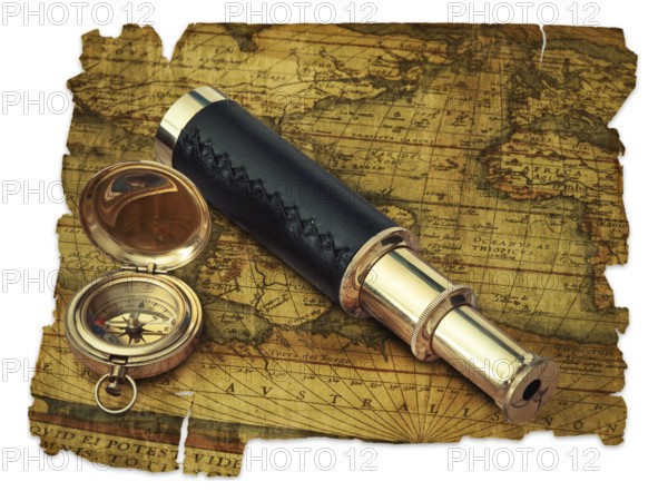 Traveling theme: vintage telescope and compass at antique (17 century) map over white