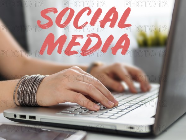 Online shopping soncept. Close-up woman's hands holding credit card and inputting card information using laptop keyboard for online shopping