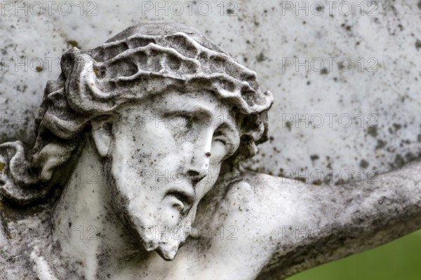Crucifixion of Jesus on a gravestone in the Barbarafriedhof cemetery in Linz, Austria, Suffering and Dying Austria, Europe